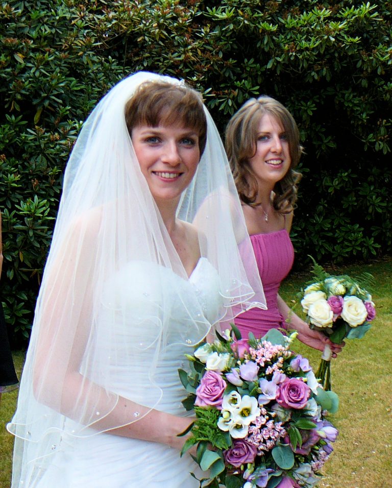 Bride and friend with flowers
