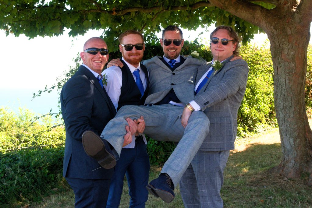 Groom with Ushers in Sun Glasses An example of Isle of Wight wedding photograph.